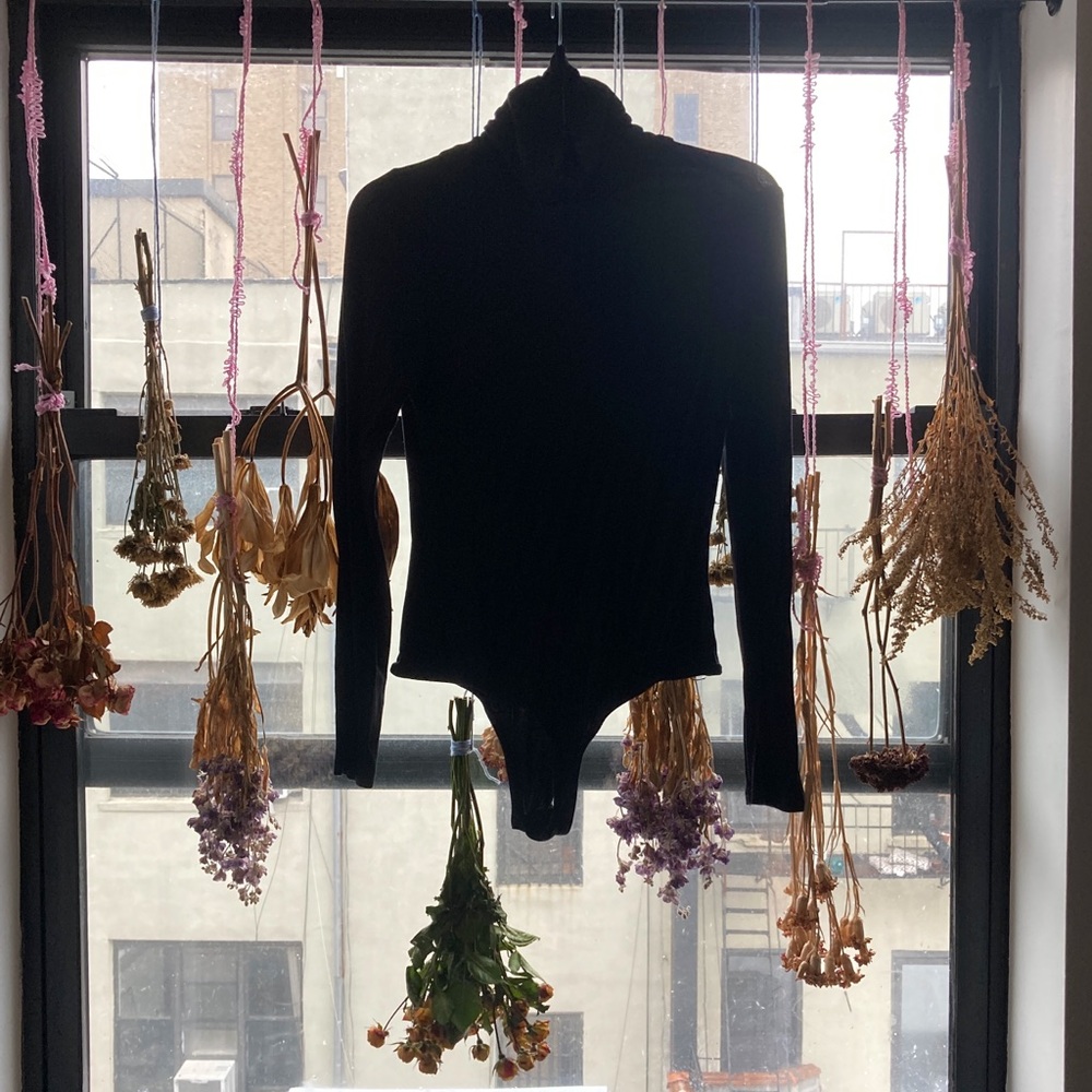 Black turtleneck bodysuit